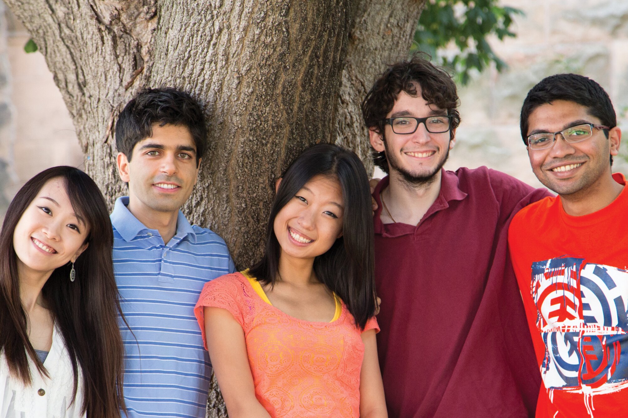 Group photo of diverse international students posing on campus